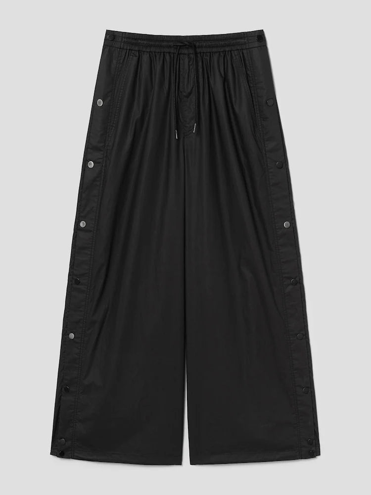 PANTALONES ANCHOS DE ALGODÓN CON BOTONES A PRESIÓN LATERALES Y CÁLIDOS NEGROS