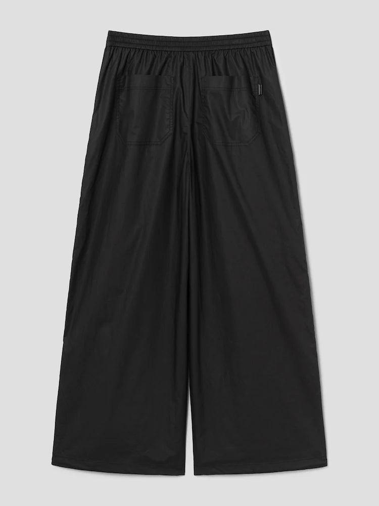 PANTALONES ANCHOS DE ALGODÓN CON BOTONES A PRESIÓN LATERALES Y CÁLIDOS NEGROS