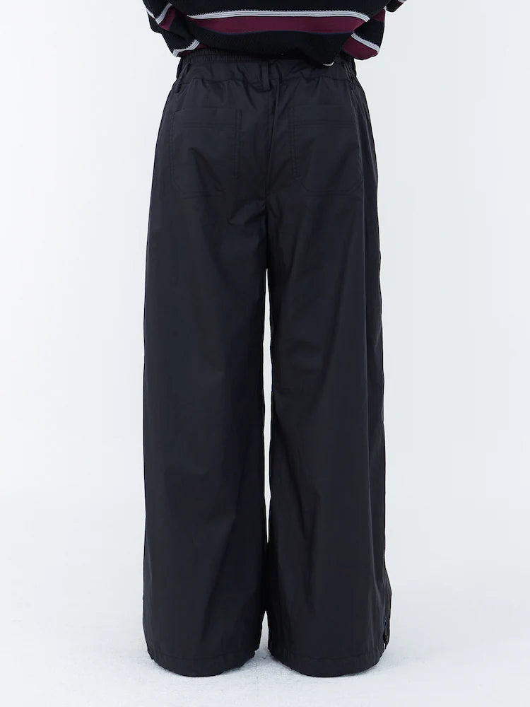 PANTALONES ANCHOS DE ALGODÓN CON BOTONES A PRESIÓN LATERALES Y CÁLIDOS NEGROS