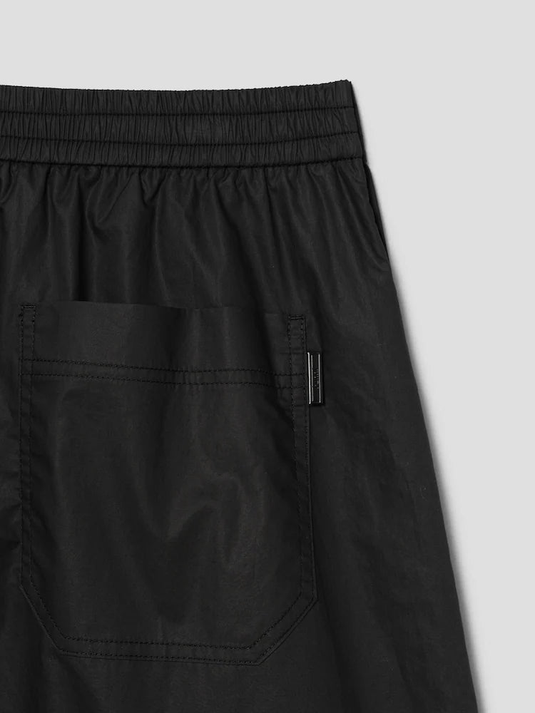 PANTALONES ANCHOS DE ALGODÓN CON BOTONES A PRESIÓN LATERALES Y CÁLIDOS NEGROS