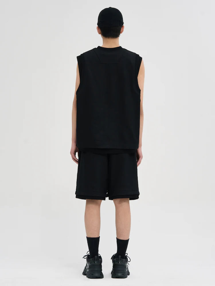 NEGRO REVERSIBLE SIN MANGAS