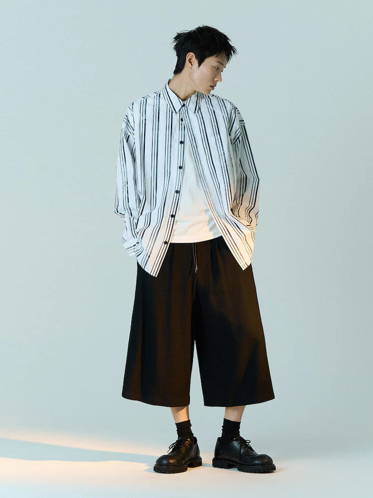 CAMISA OVERSIZE DE RAYAS BLANCAS Y NEGRAS LAVADAS