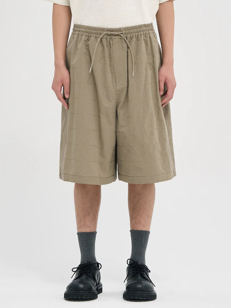PANTALONES CORTOS DE LINO BEIGE CON COSTURAS ANCHAS