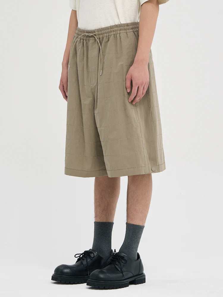 PANTALONES CORTOS DE LINO BEIGE CON COSTURAS ANCHAS