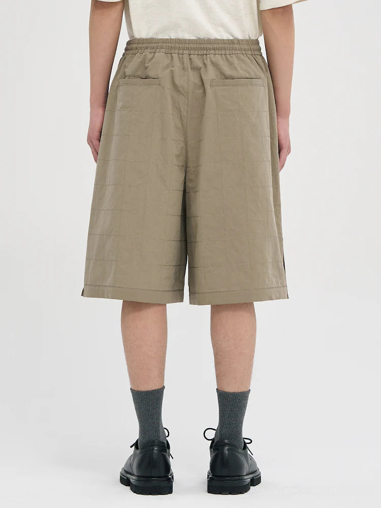 PANTALONES CORTOS DE LINO BEIGE CON COSTURAS ANCHAS
